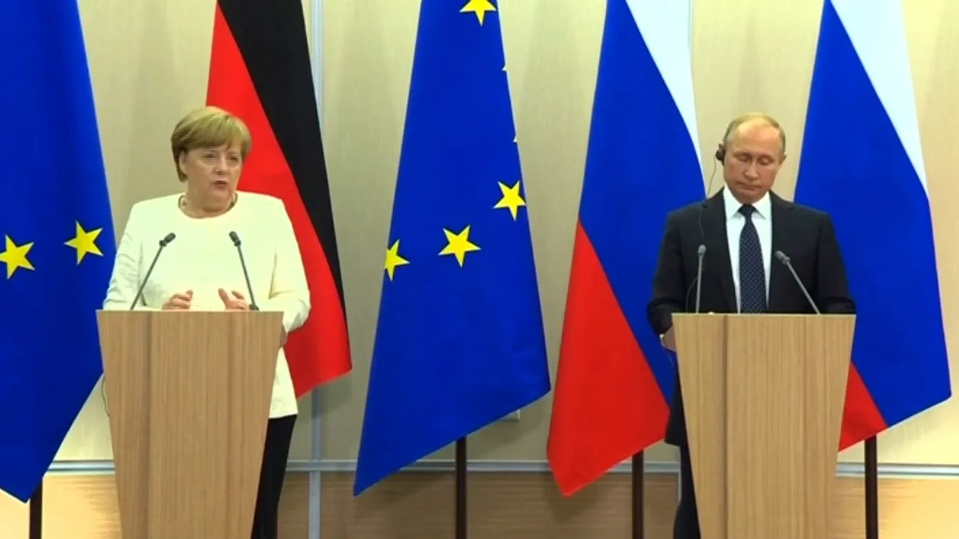 Merkelnek láthatóan jobban tetszett a virág, mint a kutya